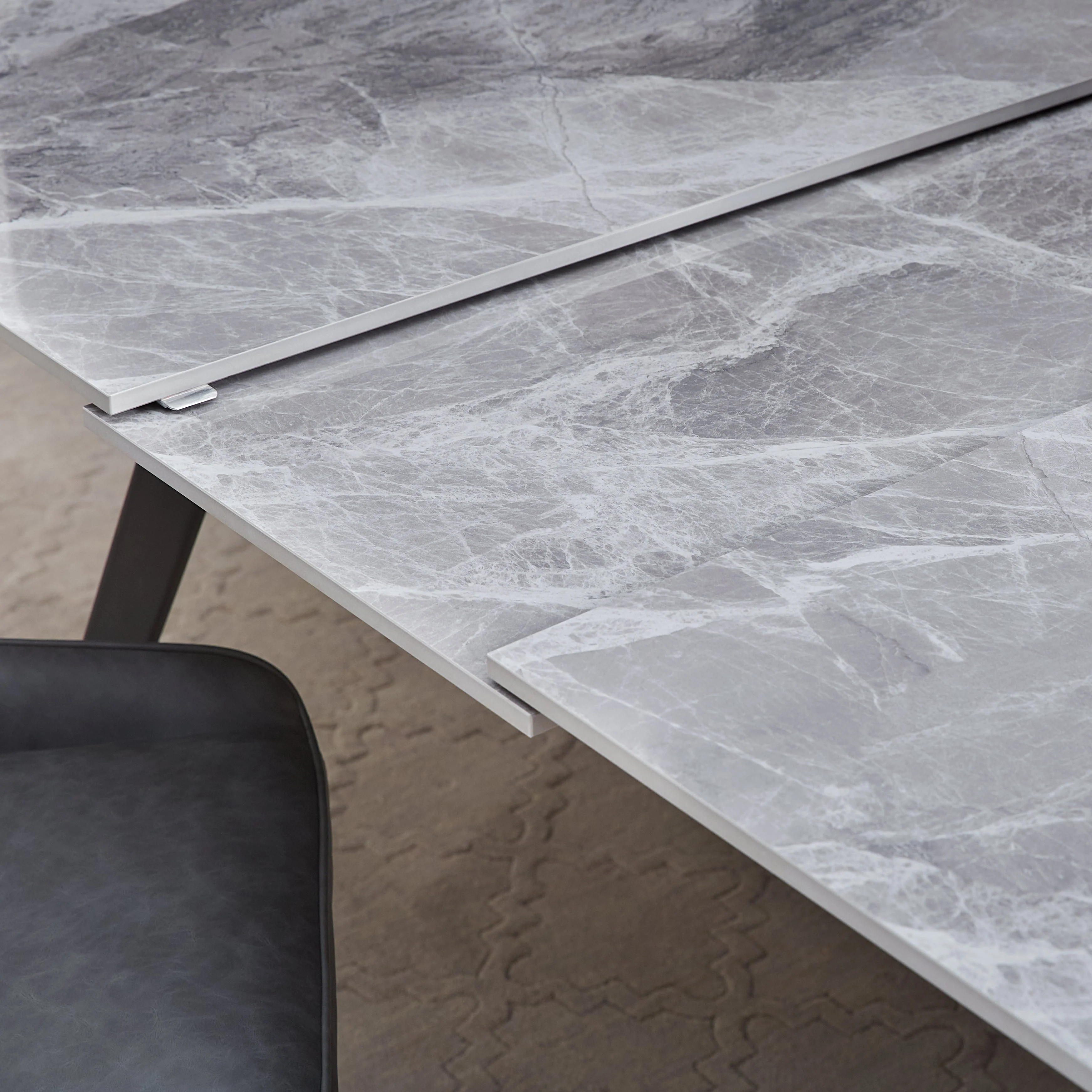 Lucia Extendable Stone Top Metal Leg Dining Table in Piedra and Black - Image 4